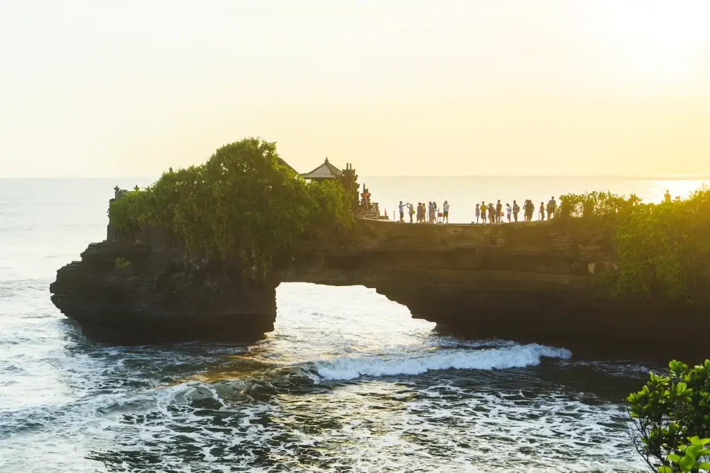 Tanah Lot temple on Bali coastline at sunset