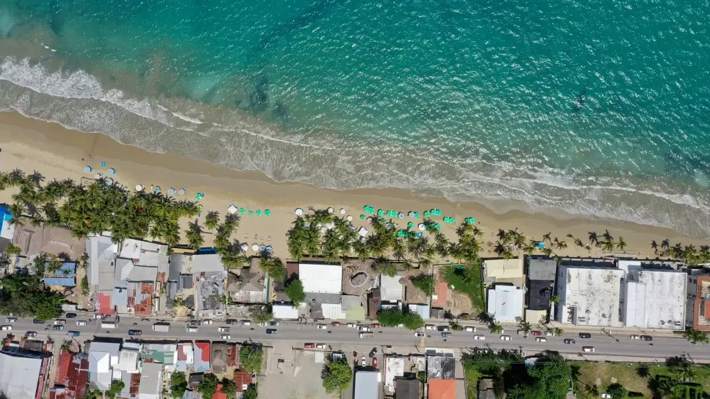 Kuta bali aerial shot of the turquoise beach with buildings